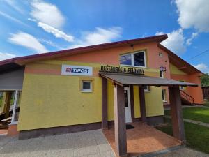 a building with a sign that reads emergency room at Penzión Poloniny in Ulič