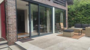 a patio with sliding glass doors on a house at Kamińsko 544 in Kamińsko