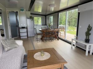 a living room with a couch and a table at Peppa Puhkemaja in Vahtrepa