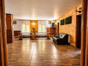 a living room with a couch and a table at Cabana Tarța din Blidari 1 in Baia Mare