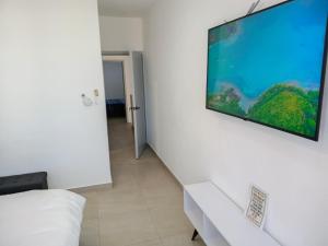 Un televizor și/sau centru de divertisment la Condominio CB