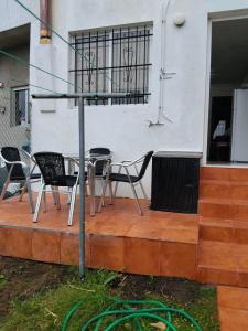 a table and chairs sitting on a patio at O Recuncho da Xunqueira in Viveiro