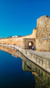 a view of a wall and a body of water at La Perle de Bizerte in Banzart