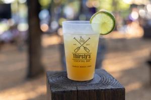 a drink in a cup with a lime on it at Suites at Waterside in Branson