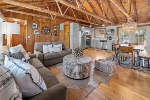 a living room with a couch and a table at Serenity - 60 Ridge Lane in Branson