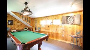 a room with a pool table and a staircase at Welch View 68 Thornton Deluxe Private 4 Bedroom Home in Thornton