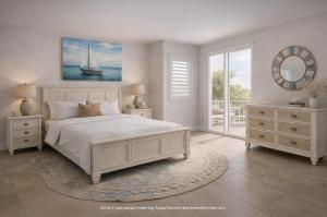 a bedroom with a white bed and a sailboat on the wall at Westgate Bimini Bay in Bailey Town