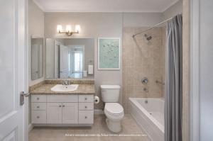 a bathroom with a toilet and a sink and a tub at Westgate Bimini Bay in Bailey Town