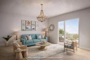 a living room with a blue couch and a chandelier at Westgate Bimini Bay in Bailey Town
