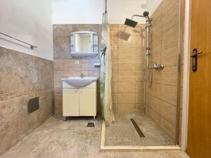 a bathroom with a shower and a sink at Lantana ex Villa Americana in Karlobag +153 photos