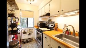 a kitchen with a sink and a stove top oven at Windsor Hill E53 WV Updated Pet Friendly Windsor Hill Condo in Waterville Valley