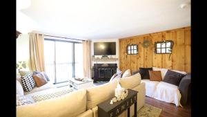 a living room with a couch and a fireplace at Windsor Hill E53 WV Updated Pet Friendly Windsor Hill Condo in Waterville Valley