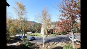 arial view of a house with cars parked in a parking lot at Windsor Hill E53 WV Updated Pet Friendly Windsor Hill Condo in Waterville Valley