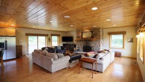 a living room with two couches and a stone fireplace at Welch View 41 Thornton Private Home Close to Waterville Valley in Thornton +11 photos