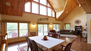 a living room with a table and chairs at Welch View 41 Thornton Private Home Close to Waterville Valley in Thornton
