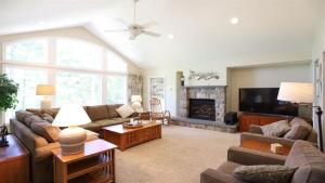 a living room with a couch and a fireplace at Rising Ridge 28 Owls Nest Deluxe Pet friendly Home at Owl`s Nest in Campton