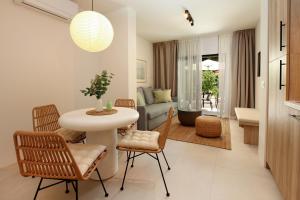 a living room with a table and chairs at Casa Serena Bol in Bol