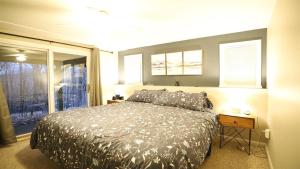 a bedroom with a bed and a window at Green Circle 29 Estates Pet Friendly Private Home in Waterville Estates in Campton