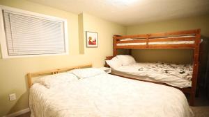 a bedroom with two bunk beds at Green Circle 29 Estates Pet Friendly Private Home in Waterville Estates in Campton +3 photos