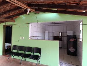 a group of chairs sitting in a room at cantinho da paz in Dourados