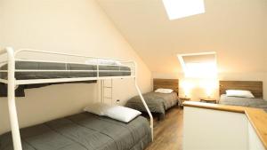 a room with two bunk beds in a attic at Valley View 4 Campton White Mountain Condo With Views in Campton