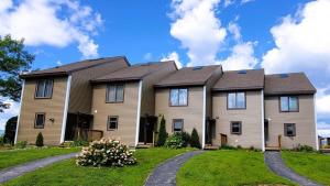 a large house with a house at Valley View 4 Campton White Mountain Condo With Views in Campton