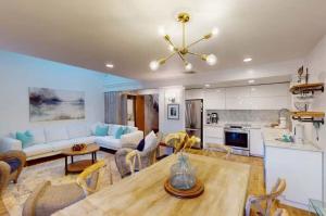a kitchen and living room with a table and chairs at 103 Ruffed Grouse Ct in Lake Harmony
