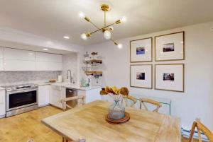 a kitchen with a wooden table with a vase of flowers on it at 103 Ruffed Grouse Ct in Lake Harmony