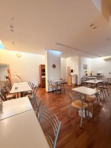 a room with tables and chairs in a building at Hotel Soles de Lidia in Monte Cristo