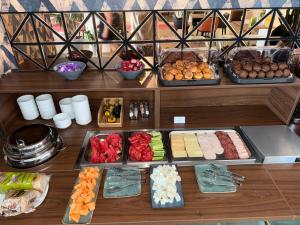 a buffet with different types of food on display at Hotel Sutomore & Apartments in Sutomore