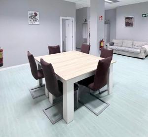 a conference room with a table and chairs at Hostel LAS ROSAS in Madrid