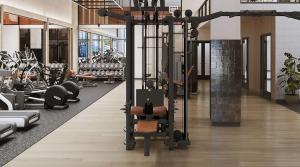a gym with a lot of treadmills and machines at Chic Luxury 1BR Oasis in Miami