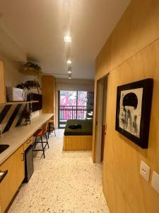 a kitchen and living room with a view of a room at U House in São Paulo