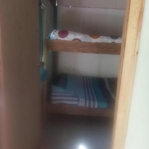 a pair of bunk beds in a room at Cabaña Villa Samantha in Buenaventura +12 photos