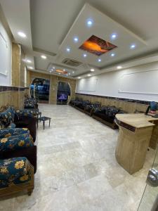 a waiting room with couches and a podium in a building at Bani motel in Duhok