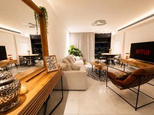 a living room with a couch and a table at amor premium residence-4BR apartment with balcony in Beer Sheva