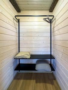 a sauna with a bench in a wooden wall at Будиночки Ґалєрія in Vaydry +4 photos