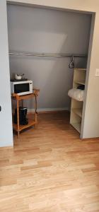 a small room with a table and a microwave at Brown Family Farm in Grand Forks