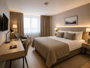 a hotel room with a bed and a desk at KM Rentals - Lillestrøm City Centre - Selected Hotels in Lillestrøm