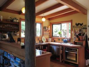 a large kitchen with a counter and a stove at Beaconstone - your perfect escape in Charleston