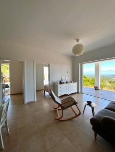a living room with a couch and a chair at Villa Peony Koroni in Koroni
