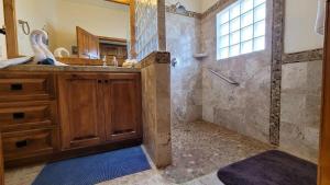 a bathroom with a shower and a sink at Casa Evita in Puerto Peñasco +16 photos
