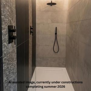 anassigned image of a shower in a bathroom at Uno By The Sea - Boutique Hotel in St Ives