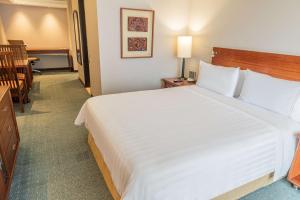 a large white bed in a hotel room at GHL Hotel Capital in Bogotá