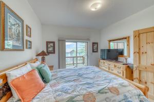 a bedroom with a large bed and a television at Lookout Ridge 63 in Dillon