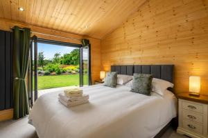 a bedroom with a large white bed with a window at 2 Bed in Nafferton oc-p31955 in Nafferton