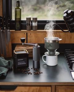 a kitchen counter with a coffee maker and a pot at Altair in Holywell +12 photos