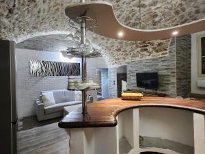 a living room with a couch and a chandelier at Dolce Vita Terrace On the Ocean - Veranda Sul Mare in Vieste