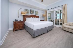 a bedroom with a large bed and a couch at Phoenix West 603 in Orange Beach +41 photos