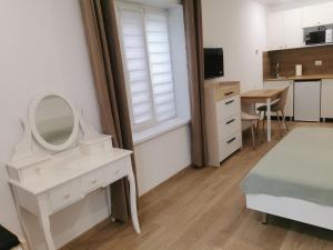 a bedroom with a dressing table and a mirror at Happy Home1 in Cahul